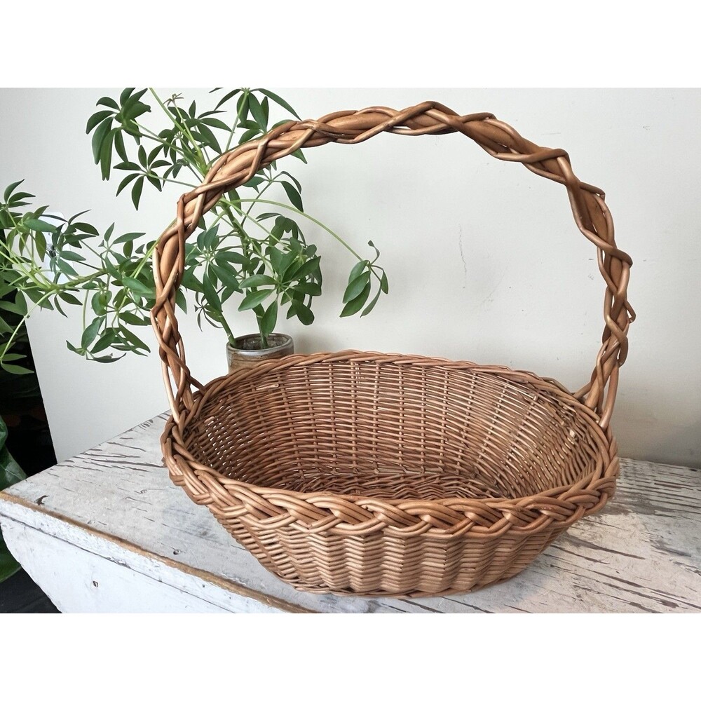 Vintage Cottage Wicker Woven Flower Basket With An Ornate Intertwined Handle